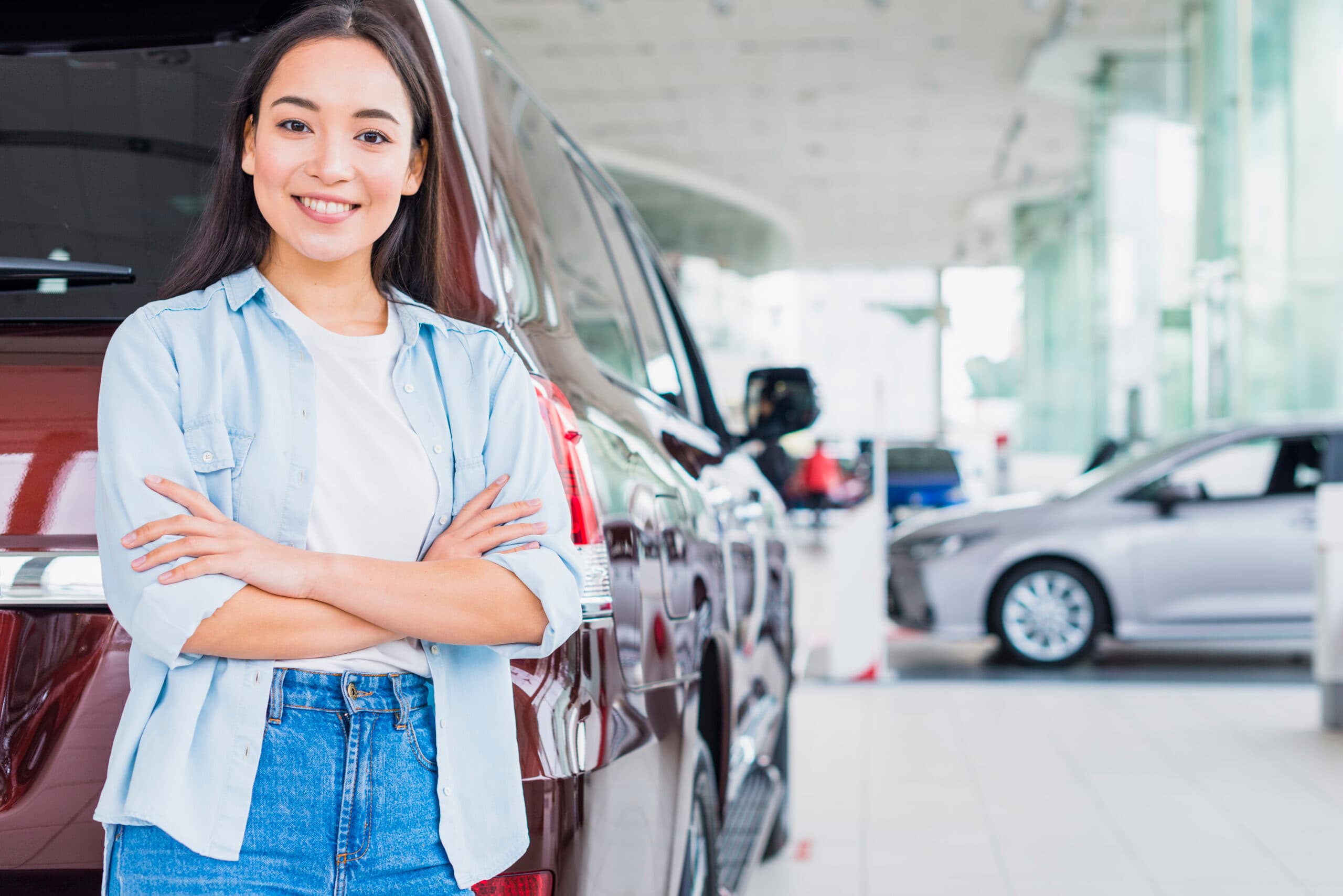 Happy customer in a car dealership